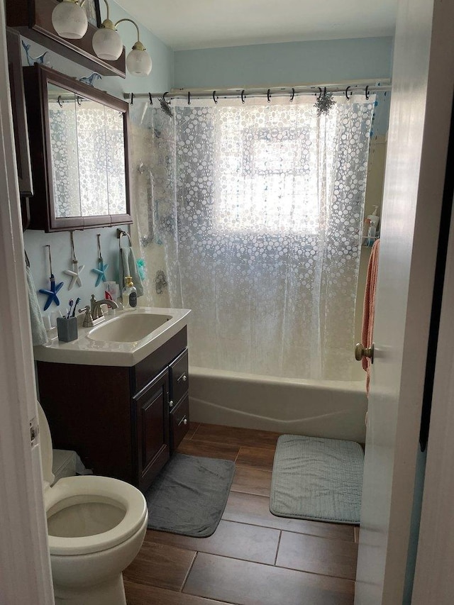 215-217 E Vermont St, Villa Park, IL 60181 - bathroom featuring shower / bath combination with curtain, vanity, toilet, and wood tiled floors