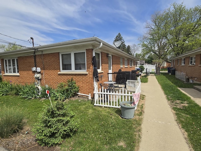 215-217 E Vermont St, Villa Park, IL 60181 - view of home's exterior with brick siding and fence