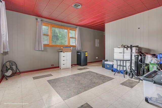 4536 W 79th Pl, Chicago, IL 60652 - misc room featuring wood walls, baseboards, and tile patterned flooring