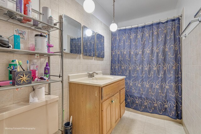 4536 W 79th Pl, Chicago, IL 60652 - bathroom featuring tile walls, tile patterned floors, a shower with curtain, vanity, and toilet