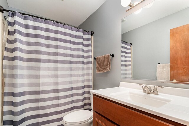 26244 S Cherry Ln, Monee, IL 60449 - bathroom with toilet, vanity, and a shower with curtain