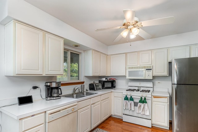 26244 S Cherry Ln, Monee, IL 60449 - kitchen featuring white appliances, a sink, light countertops, and a ceiling fan