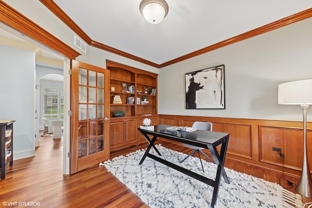 210 S Prospect St, Clarendon Hills, IL 60514 - office featuring arched walkways, ornamental molding, wood finished floors, wainscoting, and french doors