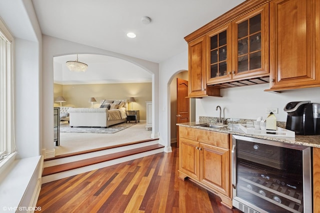 210 S Prospect St, Clarendon Hills, IL 60514 - indoor wet bar with beverage cooler, arched walkways, and dark wood-type flooring