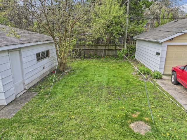 341 W Glen Flora Ave, Waukegan, IL 60085 - view of yard featuring a garage and an outbuilding