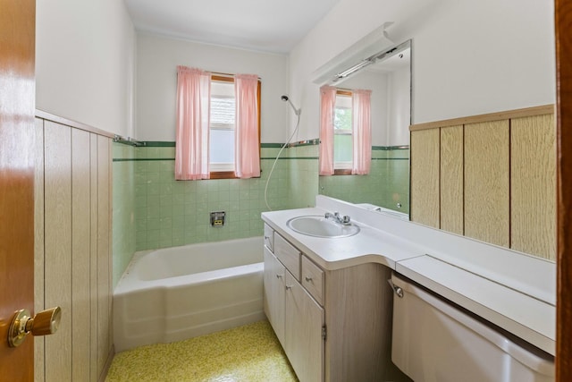 341 W Glen Flora Ave, Waukegan, IL 60085 - bathroom with a wainscoted wall, vanity, and a tub to relax in