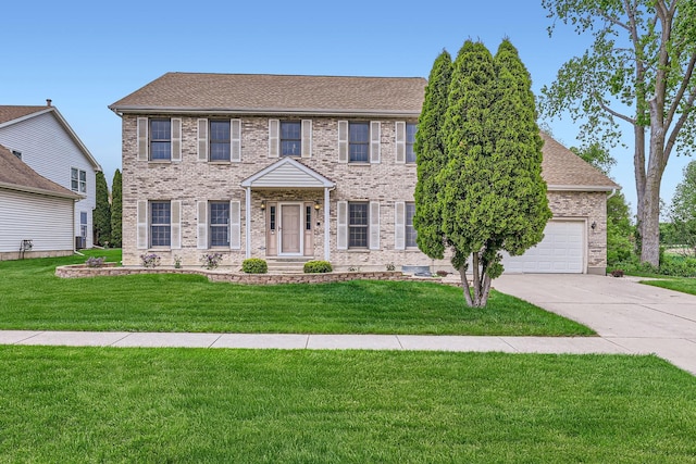 1574 Crowfoot Cir, Hoffman Estates, IL 60169 - colonial inspired home with a front yard, driveway, an attached garage, and brick siding