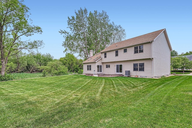 1574 Crowfoot Cir, Hoffman Estates, IL 60169 - back of property featuring a chimney and a yard