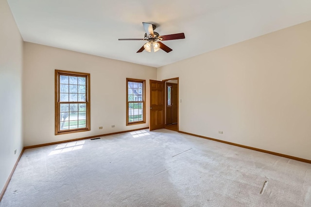 1574 Crowfoot Cir, Hoffman Estates, IL 60169 - empty room featuring baseboards, a ceiling fan, and light colored carpet