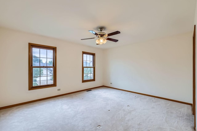 1574 Crowfoot Cir, Hoffman Estates, IL 60169 - spare room with light carpet, baseboards, and a ceiling fan