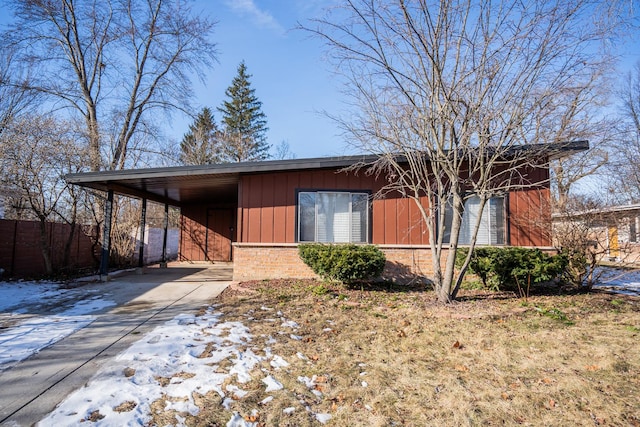 458 Tahoe St, Park Forest, IL 60466 - view of front of house with concrete driveway, fence, brick siding, and a carport