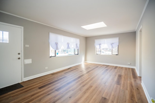 458 Tahoe St, Park Forest, IL 60466 - unfurnished room with crown molding, a skylight, wood finished floors, and baseboards