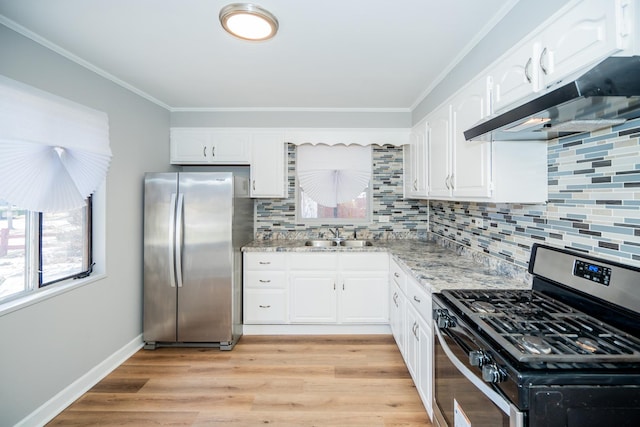 458 Tahoe St, Park Forest, IL 60466 - kitchen with stainless steel appliances, under cabinet range hood, white cabinets, light wood-style floors, and decorative backsplash
