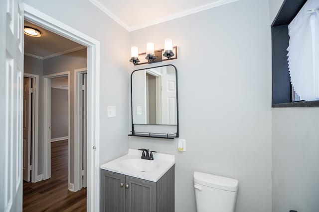 458 Tahoe St, Park Forest, IL 60466 - bathroom featuring crown molding, toilet, wood finished floors, vanity, and baseboards