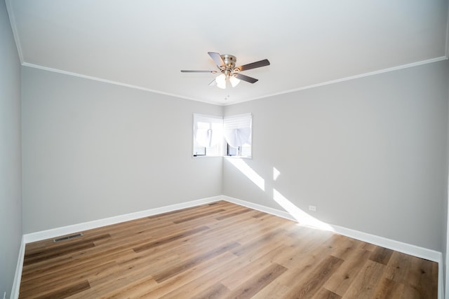 458 Tahoe St, Park Forest, IL 60466 - spare room featuring ceiling fan, baseboards, light wood-style floors, and ornamental molding