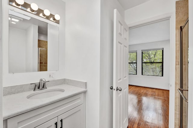 1815 N Bissell St Unit 3, Chicago, IL 60614 - bathroom featuring vanity, tiled shower, and wood finished floors