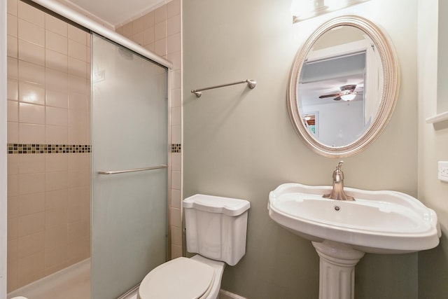 8144 Bunker Dr, Orland Park, IL 60462 - bathroom with a shower stall, toilet, and a ceiling fan