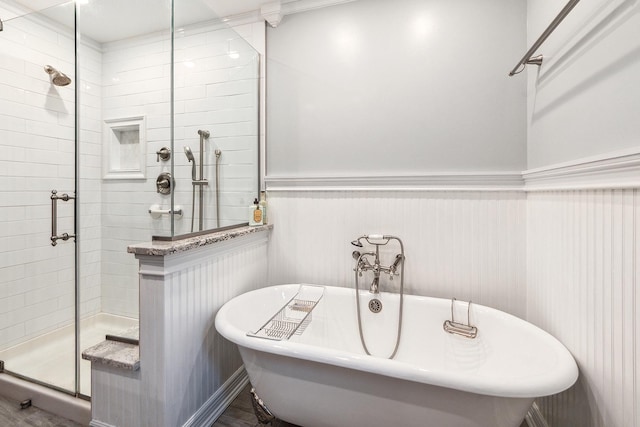 8144 Bunker Dr, Orland Park, IL 60462 - bathroom featuring a stall shower, a soaking tub, and wainscoting
