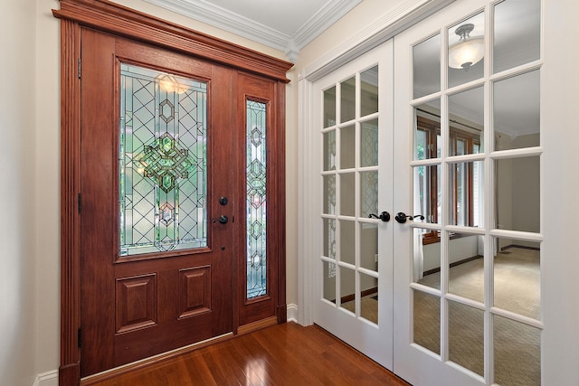 8144 Bunker Dr, Orland Park, IL 60462 - foyer entrance featuring crown molding, french doors, dark wood-style flooring, and baseboards