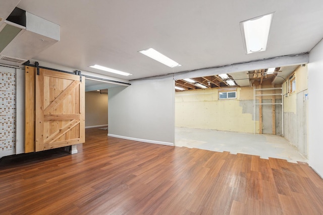 8144 Bunker Dr, Orland Park, IL 60462 - basement with wood finished floors and a barn door