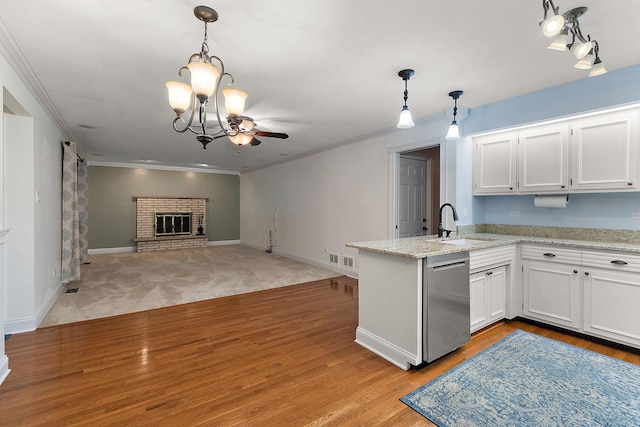 8144 Bunker Dr, Orland Park, IL 60462 - kitchen with dishwasher, a sink, a peninsula, white cabinets, and crown molding