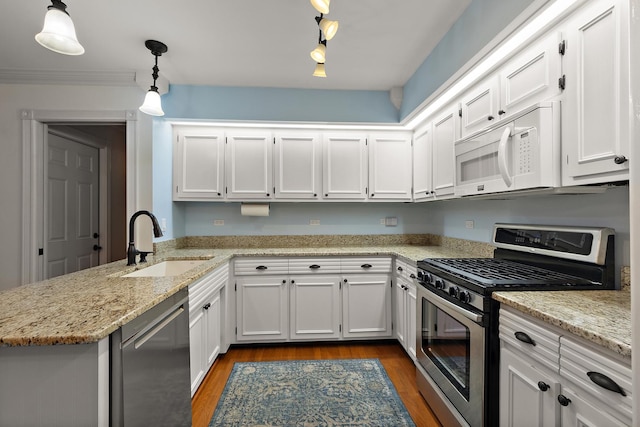 8144 Bunker Dr, Orland Park, IL 60462 - kitchen with appliances with stainless steel finishes, a sink, a peninsula, white cabinets, and dark wood-style flooring