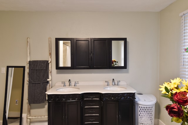 1502 S Mill St, Pontiac, IL 61764 - bathroom featuring double vanity and baseboards