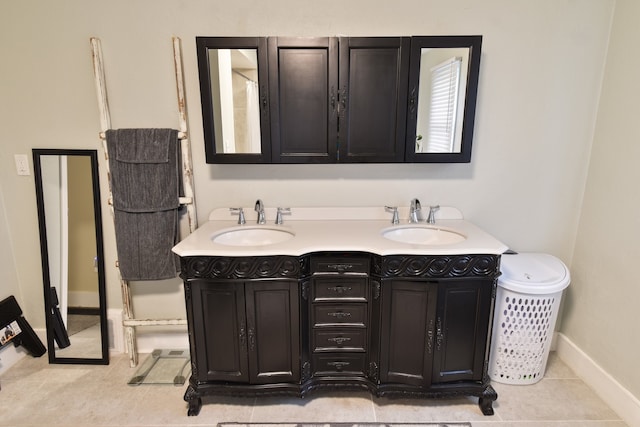 1502 S Mill St, Pontiac, IL 61764 - full bathroom with tile patterned floors, double vanity, and baseboards