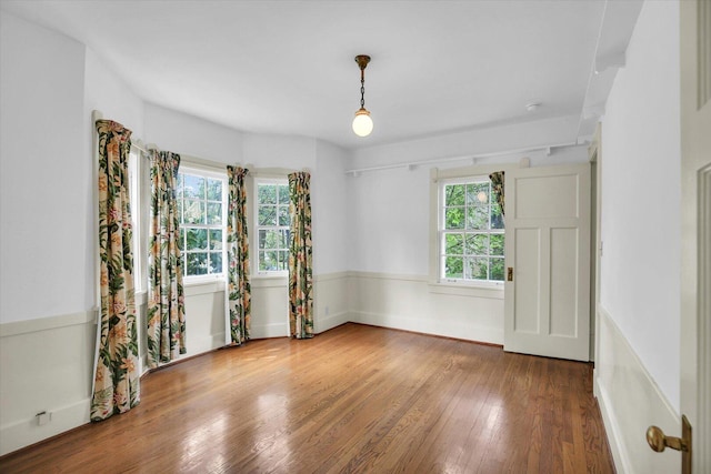 402 S Coler Ave, Urbana, IL 61801 - unfurnished room with healthy amount of natural light and wood finished floors