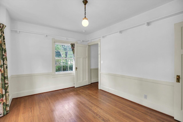 402 S Coler Ave, Urbana, IL 61801 - unfurnished room featuring wood finished floors