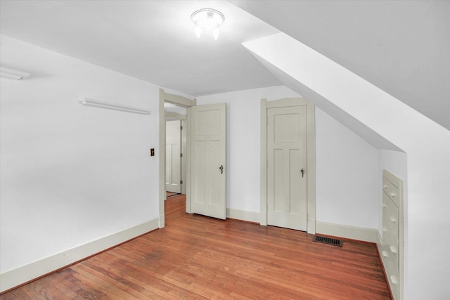 402 S Coler Ave, Urbana, IL 61801 - bonus room featuring wood finished floors and baseboards