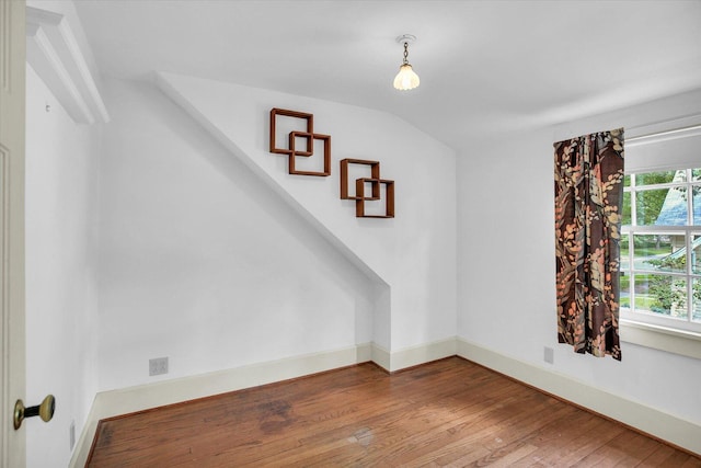 402 S Coler Ave, Urbana, IL 61801 - unfurnished room with wood finished floors and vaulted ceiling