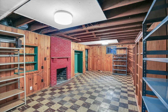 402 S Coler Ave, Urbana, IL 61801 - finished basement featuring tile patterned floors, wood walls, and a brick fireplace