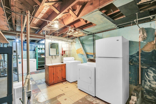 402 S Coler Ave, Urbana, IL 61801 - basement with freestanding refrigerator, washing machine and dryer, and tile patterned floors