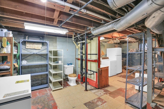 402 S Coler Ave, Urbana, IL 61801 - unfinished basement featuring tile patterned floors, freestanding refrigerator, and separate washer and dryer