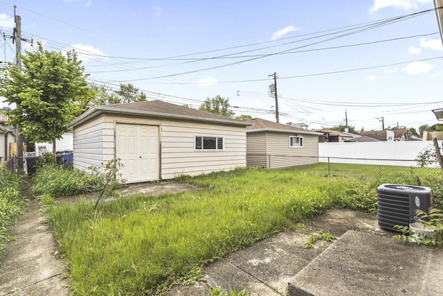 5923 W Giddings St, Chicago, IL 60630 - view of yard with cooling unit and an outbuilding
