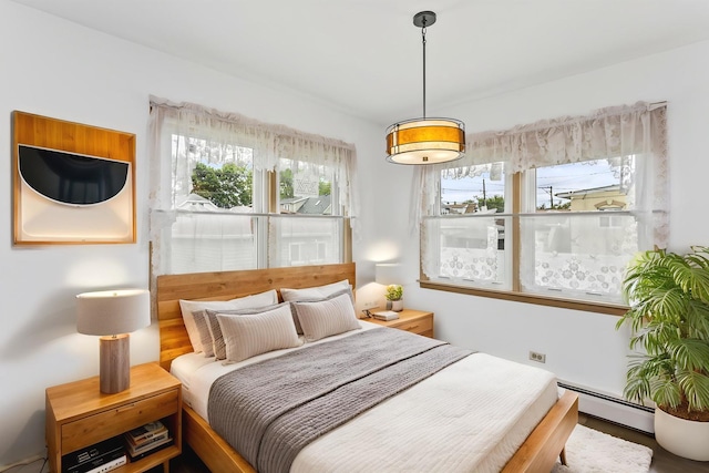 5923 W Giddings St, Chicago, IL 60630 - bedroom featuring a baseboard heating unit