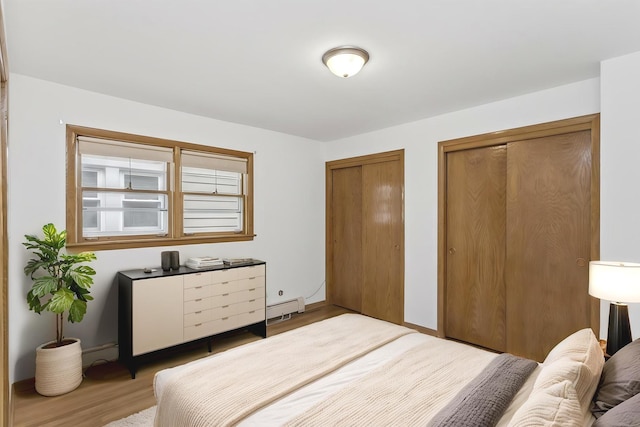 5923 W Giddings St, Chicago, IL 60630 - bedroom with two closets, wood finished floors, and baseboards