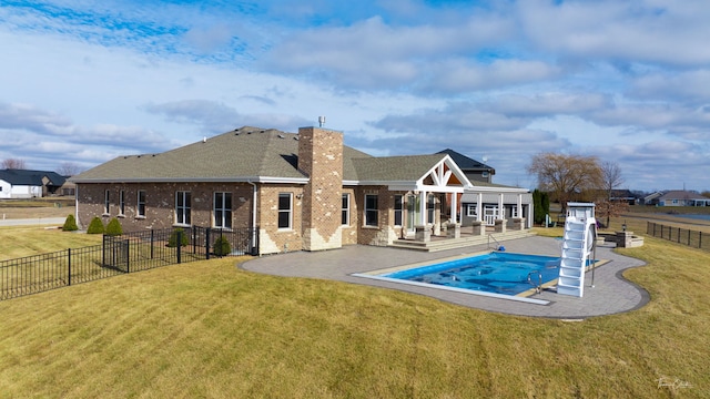 1096 Windfield Dr, Manteno, IL 60950 - rear view of property with a hot tub, brick siding, a patio, a chimney, and a shingled roof