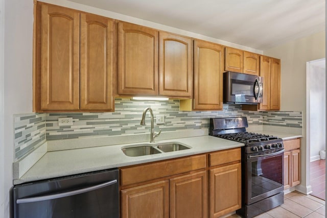 461 N Jonathan Dr Unit 104, Palatine, IL 60074 - kitchen featuring stainless steel microwave, black gas range oven, dishwashing machine, and light countertops