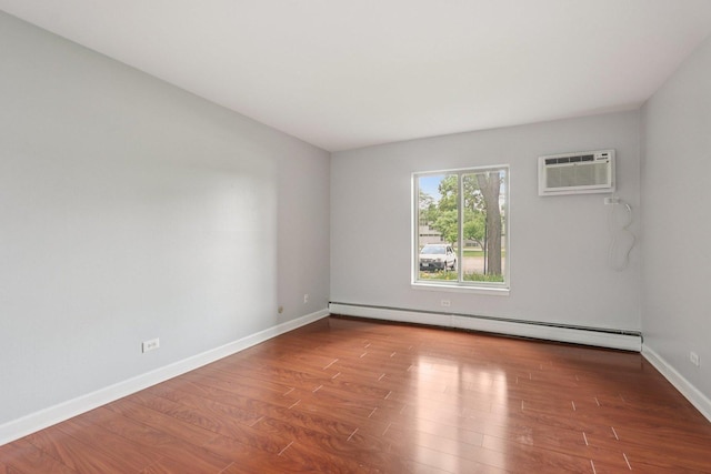 461 N Jonathan Dr Unit 104, Palatine, IL 60074 - spare room with wood finished floors, baseboard heating, and an AC wall unit