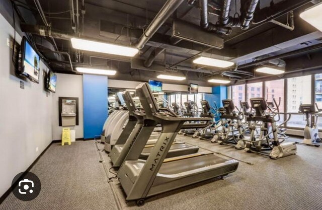 10 E Ontario St Unit 1303, Chicago, IL 60611 - workout area featuring baseboards and carpet floors