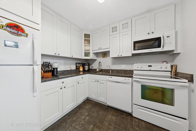 10 E Ontario St Unit 1303, Chicago, IL 60611 - kitchen featuring white appliances, a sink, white cabinetry, glass insert cabinets, and a textured ceiling