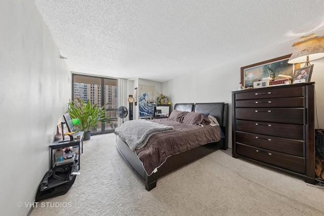 10 E Ontario St Unit 1303, Chicago, IL 60611 - bedroom with carpet flooring, a textured ceiling, access to exterior, and expansive windows