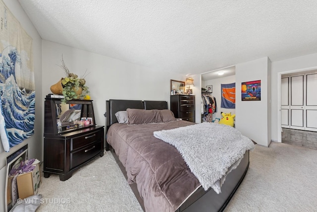 10 E Ontario St Unit 1303, Chicago, IL 60611 - bedroom with light carpet, a closet, a textured ceiling, and a spacious closet