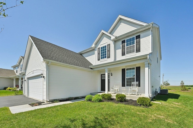1486 Keller St, Elburn, IL 60119 - traditional-style home with covered porch, asphalt driveway, a front yard, a garage, and roof with shingles