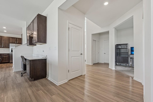 1486 Keller St, Elburn, IL 60119 - kitchen with stainless steel refrigerator, light countertops, dark brown cabinetry, light wood-style flooring, and recessed lighting