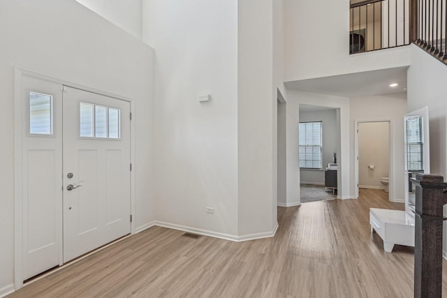 1486 Keller St, Elburn, IL 60119 - entryway with light wood-style flooring, a high ceiling, and baseboards