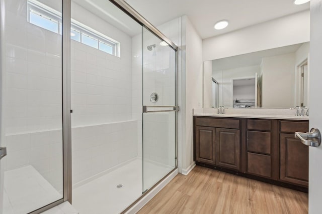 1486 Keller St, Elburn, IL 60119 - bathroom featuring a shower stall, wood finished floors, and double vanity