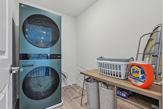 1486 Keller St, Elburn, IL 60119 - laundry room with stacked washer and clothes dryer, wood finished floors, and baseboards